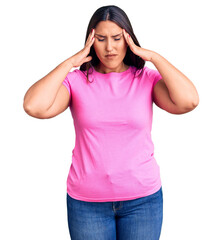 Poster - Young beautiful brunette woman wearing casual t-shirt suffering from headache desperate and stressed because pain and migraine. hands on head.