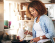 Woman, stove and cooking food in pan for healthy nutrition for morning meal prep, wellness or kitchen counter. Female person, smile and preparing breakfast for weight loss diet or dish, chef or lunch