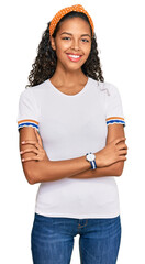 Poster - Young african american girl wearing casual clothes happy face smiling with crossed arms looking at the camera. positive person.