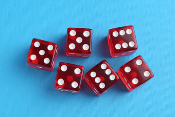 Wall Mural - Many red game dices on light blue background, flat lay