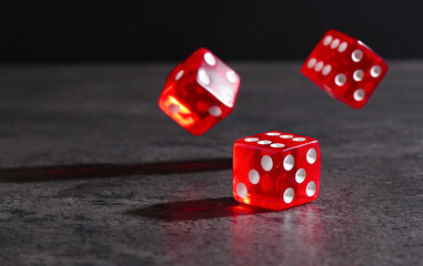 Sticker - Many red game dices falling on grey textured table