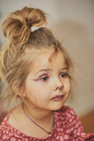 Fototapeta  - Charming child made makeup with felt-tip pens at home