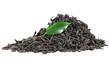 Pile of dry black tea leaves and fresh green tea leaf isolated on a white background.