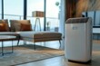 A white air purifier sits on a wooden floor in a living room. Summer heat concept