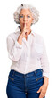 © Krakenimages.com - Senior grey-haired woman wearing casual clothes asking to be quiet with finger on lips. silence and secret concept.