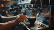 A barista makes coffee in an expensive Italian coffee machine. Close up