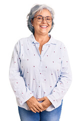 Sticker - Senior woman with gray hair wearing casual business clothes and glasses looking positive and happy standing and smiling with a confident smile showing teeth