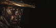 © Hoss - A close up portrait of a black male cowboy. He wears a distressed cowboy hat and the clothing of a rancher. He has beads of sweat on his face from a day of hard work.