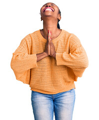 Wall Mural - Young african american woman wearing casual clothes begging and praying with hands together with hope expression on face very emotional and worried. begging.