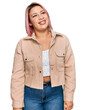 © Krakenimages.com - Hispanic woman with pink hair wearing casual clothes looking away to side with smile on face, natural expression. laughing confident.