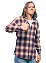 Wall Mural - Handsome caucasian man with long hair wearing hipster shirt doing happy thumbs up gesture with hand. approving expression looking at the camera showing success.