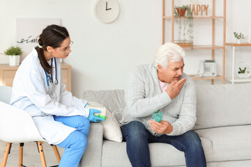 Canvas Print - Senior man with nebulizer and nurse at home