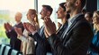 © keiron - Group of business people clapping and applauding during office conference presentation or training