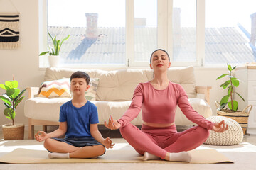 Sticker - Mother with her little son meditating at home