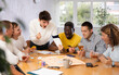 © JackF - Group of active men play board games during a friendly meeting
