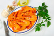 King fried prawns with parsley and spice on white plate. Llagosti