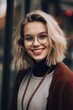 © Balaraw - smiling young woman with glasses and wavy blonde hair