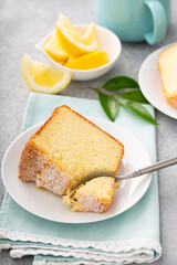 Wall Mural - Lemon pound cake baked in a bundt pan topped with powdered sugar