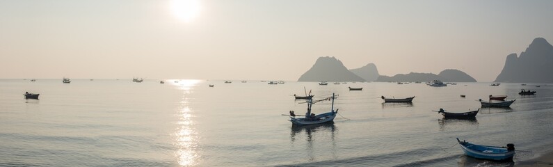 Wall Mural - panoramic beautiful sunrise on the ocean. boats and tropical sea. beautiful landscape from the viewp
