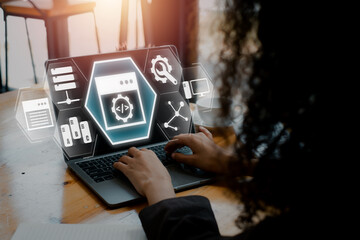 Wall Mural - python concept, businesswoman using laptop computer on desk with python icon on virtual screen.