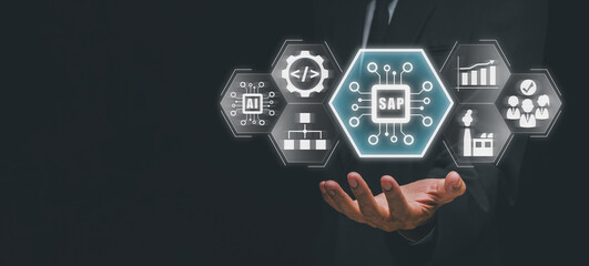 SAP, Systems Applications and Products concept, Businessman hand holding Systems Applications and Products icon on virtual screen.