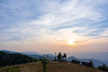 Poster - Scenic mountain landscape and bright sunrise or sunset sky over the horizon. Natural skyscape background