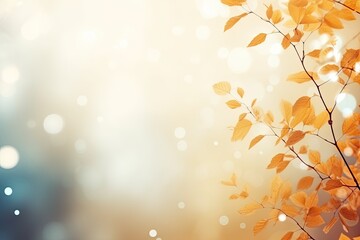Wall Mural - Dry Yellow Leaves and Tree Branches on Blue and Orange Gradient Blur Bokeh Background. Copy Space for Autumn Banner or Poster