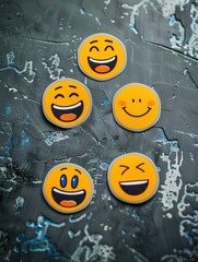 Poster - A row of five smiling faces are arranged on a grey surface