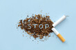 © Pcess609 - Broken cigarette scattered tobacco with text STOP on a light blue background. Quit smoking concept. stop smoking, World No Tobacco Day. say no. quit smoking for health. drugs, Lung Cancer, emphysema.