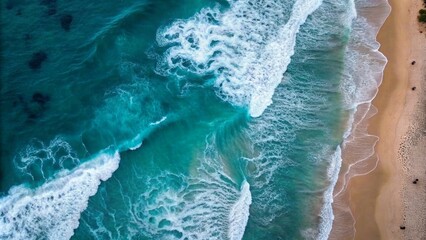 Aerial view of the beach with waves, captured from above by an iPhone camera, showcasing the vastness and beauty of nature's creation.