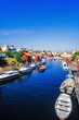 Boats in an canal in a idyllic swedish fishing village a sunny summer day