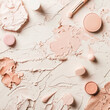 a close up of a variety of makeup products on a white surface