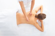 Young woman getting massaging treatment over white. Spa, healthcare and recreation concept.