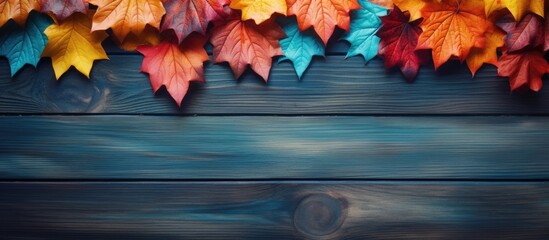 Aufkleber - Top view of autumn leaves arranged in a flat lay composition on a wooden background creating a visually appealing copy space image