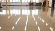 New shiny epoxy resin floor in a large, brightly lit room. Office, warehouse, production workshop after renovation.