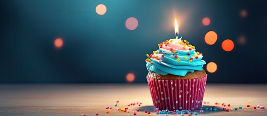 Aufkleber - A homemade cupcake with a lit candle is placed on a simple background creating a cheerful birthday greeting card The copy space image also includes a gift box for the birthday holiday celebration