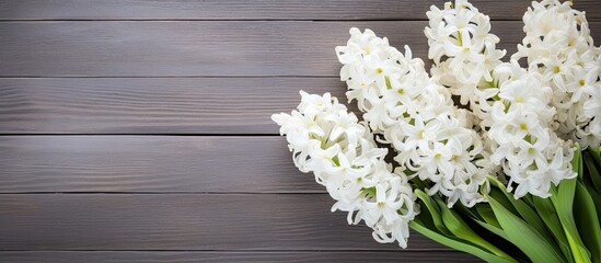 Poster - White hyacinths in a bouquet placed on a weathered wood background create a visually captivating copy space image