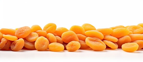 Wall Mural - A copy space image of dried apricots displayed on a white background