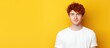 © HN Works - There is a red haired guy wearing a white T shirt standing in front of a yellow background with copy space for printing template