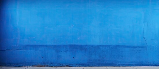 Poster - A vibrant blue wall serves as the backdrop allowing for ample space to add images or text