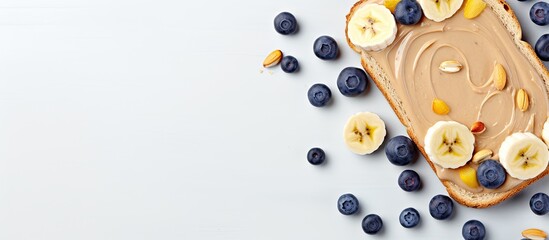 Poster - Top view of a peanut butter sandwich with bananas and blueberries providing ample space for text in the image