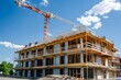 © Kdhtdg - Building under construction. Construction site with crane