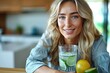 Young woman enjoys detox beverage in kitchen with glass of citrus-infused water for freshness