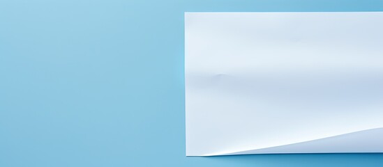 Aufkleber - A white sheet of paper is placed on a blue background providing ample copy space for text The image showcases a print design concept