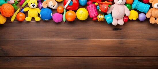 Aufkleber - A vibrant frame made of colorful kids toys is displayed on a wooden background as seen from a top view perspective The image is laid flat and provides ample space for text