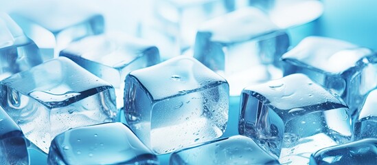 Poster - A light blue background sets the stage for crystal clear ice cubes in this copy space image creating a color tone effect