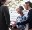 © peopleimages.com - Meeting, city and business women with documents for planning, discussion and in conversation. Professional, corporate team and people in town with paperwork for talking, communication and networking