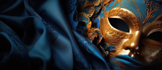 Aufkleber - Blue silk fabric with a magnificent gold carnival mask placed strategically leaving ample copy space image