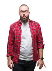 Sticker - Young caucasian hipster man wearing glasses over isolated background making fish face with lips, crazy and comical gesture. Funny expression.