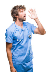 Wall Mural - Handsome hispanic surgeon doctor man over isolated background shouting and screaming loud to side with hand on mouth. Communication concept.